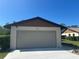 A close up shot of a one-car garage with house number at 1817 Curry Ave # 57, Nokomis, FL 34275