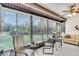 Relaxing sunroom with floor-to-ceiling windows and comfortable seating at 1817 Curry Ave # 57, Nokomis, FL 34275