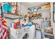 Bright laundry room with modern washer, dryer, shelving, and ample storage space at 1817 Curry Ave # 57, Nokomis, FL 34275