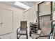 Relaxing covered patio area with tile flooring, seating and storage at 1817 Curry Ave # 57, Nokomis, FL 34275