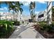 An entrance to a community that is accessible and features lush landscaping at 1922 Harbourside Dr # 1102, Longboat Key, FL 34228