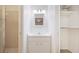 Bathroom with vanity, mirror, plus a separate shower and a closet with shelving at 2782 Woodgate Ln # 18, Sarasota, FL 34231