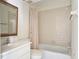 Classic bathroom with tub and shower combination, vanity, and neutral decor at 2782 Woodgate Ln # 18, Sarasota, FL 34231