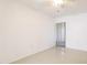 Neutral bedroom with a ceiling fan, tiled floors and sliding doors, with ample natural light at 2782 Woodgate Ln # 18, Sarasota, FL 34231