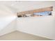 Bright bedroom with large window offering natural light and tile flooring at 2782 Woodgate Ln # 18, Sarasota, FL 34231