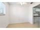 Empty dining area featuring tile flooring and an open view into the kitchen at 2782 Woodgate Ln # 18, Sarasota, FL 34231