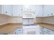 Practical kitchen setup with white appliances, cabinets, and sufficient counter space at 2782 Woodgate Ln # 18, Sarasota, FL 34231