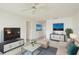 Bright living room featuring contemporary furnishings, a ceiling fan, and stylish decor at 2782 Woodgate Ln # 18, Sarasota, FL 34231