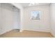 Bright living room featuring tile floors and window, offering a clean and open space at 2782 Woodgate Ln # 18, Sarasota, FL 34231