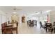 Bright recreation room featuring multiple seating areas and kitchen access at 2782 Woodgate Ln # 18, Sarasota, FL 34231