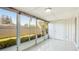 Sunroom with tile flooring and large windows overlooking the backyard at 2782 Woodgate Ln # 18, Sarasota, FL 34231