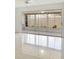Sunroom with tile flooring and large windows overlooking the backyard at 2782 Woodgate Ln # 18, Sarasota, FL 34231