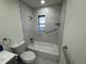 Clean bathroom featuring white tiled tub and shower at 3813 42Nd W St # 37, Bradenton, FL 34205