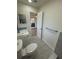 Accessible bathroom with sleek fixtures and a view to another room at 3813 42Nd W St # 37, Bradenton, FL 34205