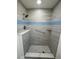 Updated shower features mosaic tile flooring, glass tile accent, and accessible grab bar at 3813 42Nd W St # 37, Bradenton, FL 34205