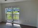 Bedroom features hardwood floors and view of neighborhood through the window at 3813 42Nd W St # 37, Bradenton, FL 34205