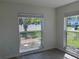 Bedroom featuring a view of a well-manicured front lawn through two windows at 3813 42Nd W St # 37, Bradenton, FL 34205
