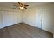 Bright bedroom with wood-look flooring and ceiling fan at 3813 42Nd W St # 37, Bradenton, FL 34205