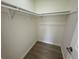 Walk-in closet with ample storage space, featuring hardwood flooring at 3813 42Nd W St # 37, Bradenton, FL 34205