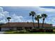 Attractive low-rise community building showcasing manicured landscaping and palm trees at 3813 42Nd W St # 37, Bradenton, FL 34205