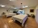 Spacious game room with two pool tables, wood floors, and overhead lighting fixtures at 3813 42Nd W St # 37, Bradenton, FL 34205