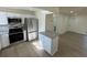 Updated kitchen featuring stainless appliances, modern white cabinets, and an eat-in island at 3813 42Nd W St # 37, Bradenton, FL 34205