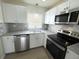 Well-lit kitchen boasts granite counters, stainless appliances, and subway tile backsplash at 3813 42Nd W St # 37, Bradenton, FL 34205