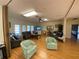 Large living room with lots of windows, wood floor, and comfortable seating at 3813 42Nd W St # 37, Bradenton, FL 34205