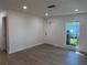 Bright living room featuring neutral walls, hardwood flooring, and a front door at 3813 42Nd W St # 37, Bradenton, FL 34205