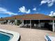 Spacious patio area with ample seating and a view of the pool and clear sky at 3813 42Nd W St # 37, Bradenton, FL 34205