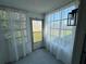 Bright sunroom with multiple windows offering outdoor views and natural light at 3813 42Nd W St # 37, Bradenton, FL 34205