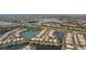 A scenic aerial view shows residences and lakes in a well-maintained neighborhood with lush greenery at 5521 Bilbao Pl, Sarasota, FL 34238