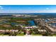 Expansive aerial view showcases community amenities, lakes, and beautiful homes with lush green surroundings at 5521 Bilbao Pl, Sarasota, FL 34238