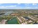 Panoramic aerial view of a community with lakes and lush landscaping on a sunny day at 5521 Bilbao Pl, Sarasota, FL 34238