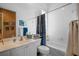 Bathroom with tiled shower-tub combination and vanity with a large mirror, ideal for Gathering use at 5521 Bilbao Pl, Sarasota, FL 34238