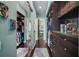 Spacious walk-in closet featuring custom shelving and mirrored doors for ample storage and organization at 5521 Bilbao Pl, Sarasota, FL 34238