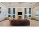 Bright and airy lounge area with comfortable seating, fireplace, and stylish decor at 8612 Sundance Loop, Sarasota, FL 34238