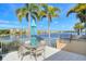 Outdoor kitchen with barbecue area and waterfront views offers a perfect setting for entertaining guests at 10510 Boardwalk Loop # 602, Bradenton, FL 34202