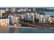 Beautiful waterfront view of this high rise building showcasing nearby beaches and stunning city views at 11 Sunset Dr # 406, Sarasota, FL 34236