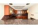 Bright kitchen with modern cabinets, granite countertops, and stylish mosaic backsplash at 11 Sunset Dr # 406, Sarasota, FL 34236