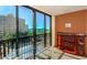 Enjoy the beautiful water view from the lanai area with a glass table and outside furnishing at 11 Sunset Dr # 406, Sarasota, FL 34236