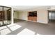 Open-concept living space features a carpeted living area and a breakfast bar with a beautiful water view at 11 Sunset Dr # 406, Sarasota, FL 34236