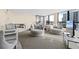 Cozy living room with plush seating, including a round table and comfortable chairs with bright window view at 11 Sunset Dr # 406, Sarasota, FL 34236
