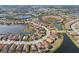 Beautiful aerial view of a home nestled among lush landscaping, lakes, and a golf course community at 26720 Weiskopf Dr, Englewood, FL 34223