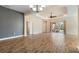 Spacious living room with tile flooring, stylish light fixtures, and access to the lanai at 26720 Weiskopf Dr, Englewood, FL 34223