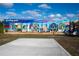 A colorful Englewood-themed mural under a bright blue sky at 26720 Weiskopf Dr, Englewood, FL 34223