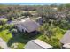 Aerial view of the property showcasing the roof, surrounding trees, and landscaping at 3443 Tallywood Cir # 7061, Sarasota, FL 34237