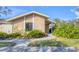 Well-maintained single-story home featuring lush landscaping and a welcoming entrance at 3443 Tallywood Cir # 7061, Sarasota, FL 34237