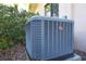 Close-up view of the home's Rheem HVAC unit outdoors, surrounded by mulch and greenery at 3443 Tallywood Cir # 7061, Sarasota, FL 34237