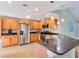 Charming kitchen featuring stainless steel appliances, granite counters and pendant lighting fixtures at 3443 Tallywood Cir # 7061, Sarasota, FL 34237